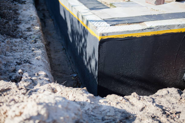Professional Basement Waterproofing technician working in DeWitt, MI
